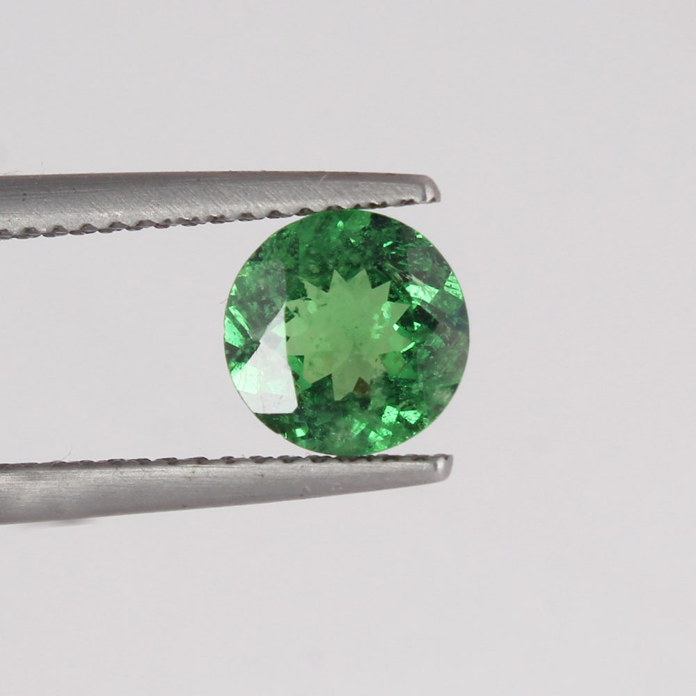 GIA Certified 1.42 ct. Tsavorite (Grossular-Garnet) - KENYA, EAST-AFRICA: GIA Certified 1.42 ct. Tsavorite (Grossular-Garnet) - KENYA, EAST-AFRICA Cut - Round Modified Brilliant Cut Color - Green Clarity - VS Ct. Weight - 1.42 ct. Dimensions - 7.13 - 7.19 X 3.70 m