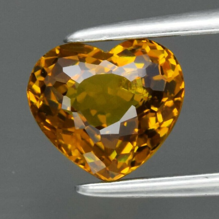 1.35 ct. Natural Unheated Mali Garnet - MADAGASCAR: 1.35 ct. Natural Unheated Mali Garnet - MADAGASCAR Cut - Heart Color - Yellow Clarity - SI1 Ct. Weight - 1.35 ct. Dimensions - 6.70 x 6.00 x 4.10 mm Origin - MADAGASCAR,