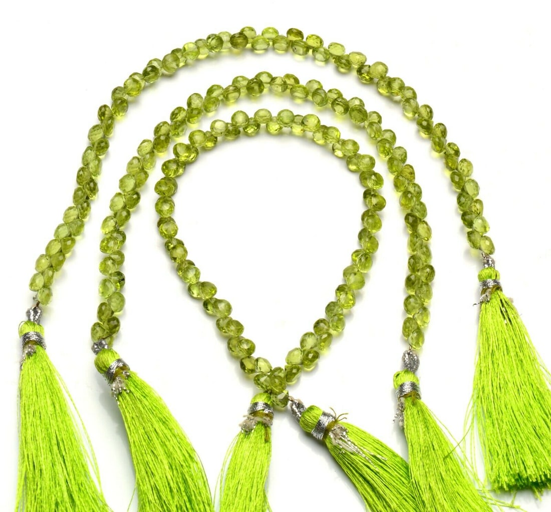 53.00 ct. Natural Peridot Beads Strand for Necklace: 53.00 ct. Natural Peridot Beads Single Strand for Necklace Color - Olive Green Shape - Onion shape beads Gem Weight - 53.00 ct. Size - 5 mm Approx. No. of strands - 1 <