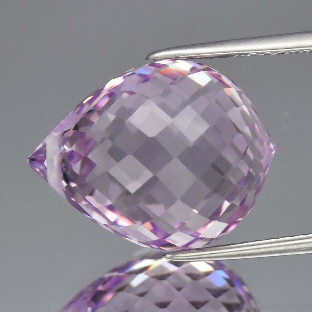 12.41 ct. Natural Unheated Light Purple Amethyst - BRAZIL: 12.41 ct. Natural Unheated Light Purple Amethyst - BRAZIL Shape - Briolette Cut, Top-Drilled Color - Light Purple Clarity - VVS Ct. Weight - 12.41 ct. Dimensions - 15.70 x 12.00 x 11.60 mm