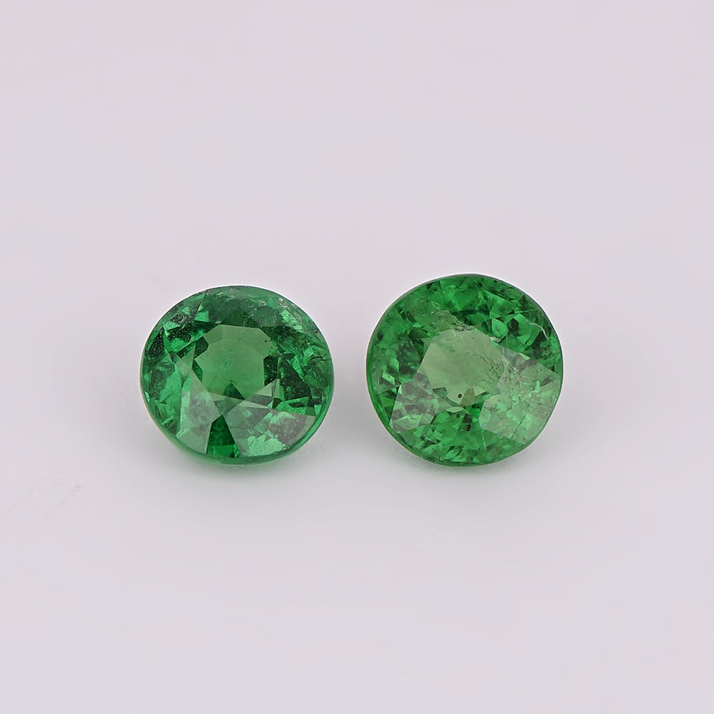 0.92 ct. Tsavorite Garnet Pair - KENYA, EAST-AFRICA: 0.92 ct. Tsavorite Garnet Pair - KENYA, EAST-AFRICA Color - Vivid Green Clarity - VS Cut - Round Ct. Weight - 0.92 ct. No. of Tsavorite Garnets - 2 Origin - KENYA, EAST-A