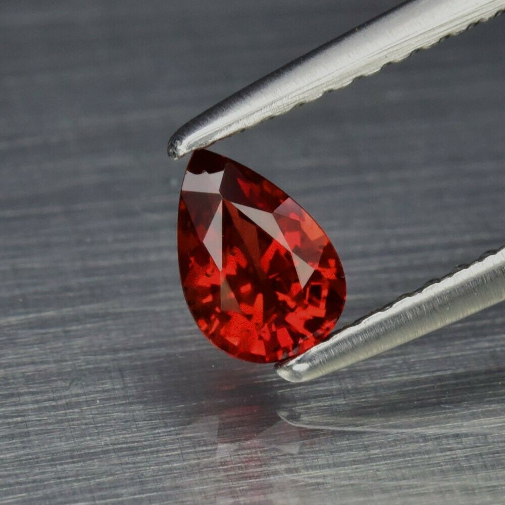 0.49 ct. Natural Orangy Red Ruby - TANZANIA: 0.49 ct. Natural Orangy Red Ruby - TANZANIA Shape - pear Color - Orangy Red Clarity - VS Ct. Weight - 0.49 ct. Dimensions - 5.80 x 4.00 x 2.80 mm Origin - TANZANIA, AFRIC