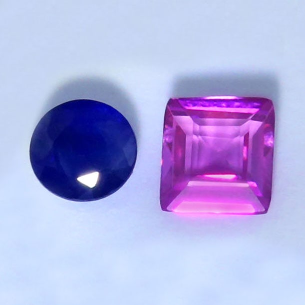 IGI Certified 0.75 ct. Sapphire and Ruby Pair: IGI Certified 0.75 ct. Sapphire and Ruby Pair Color - Blue and Purple Red Cut - Round Mixed cut and Rectangular Step cut Clarity - VS-SI Ct. wt. - 0.46 + 0.29 = 0.75 ct. Dimensions - 4.10 - 3.