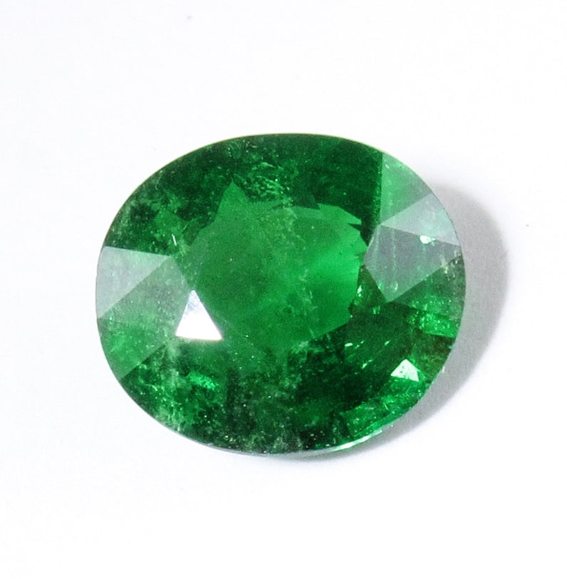 IGI Certified 1.76 ct. Untreated Tsavorite Garnet - KENYA: IGI Certified 1.76 ct. Tsavorite (Grossularite - Garnet) - Untreated - KENYA, EAST AFRICA Cut - Oval Mixed Cut Color - Intense Green Clarity - SI Ct. Weight - 1.76 ct. Dimensions - 8.04 x 7.15