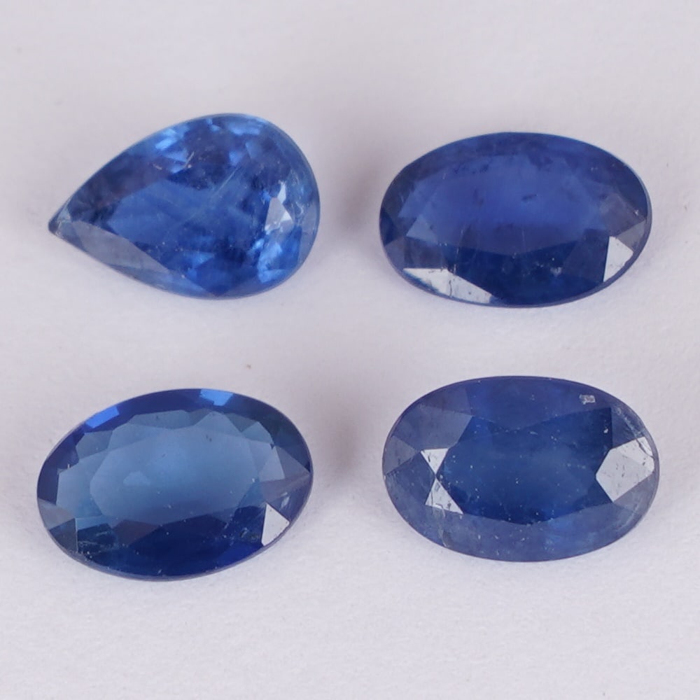 IGI Cert. 1.93 ct. Set of 4 Blue Sapphires - MADAGASCAR: IGI Certified 1.93 ct. Set of 4 Blue Sapphires - MADAGASCAR Color - Blue Cut - Oval Mixed cut & Pear Mixed cut Clarity - SI Ct. Weight - 0.61 + 0.41 + 0.46 + 0.45 = 1.93 ct. Dimensions - 5.92