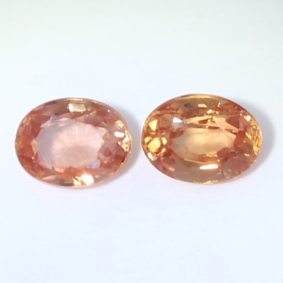 IGI certified Set of 2 Padparadscha Sapphires - MADAGASCAR: IGI certified Set of 2 Padparadscha Sapphires - MADAGASCAR Color - Pinkish Orange Clarity - VS Cut - Oval Mixed Cut Weight - 0.24 + 0.29 = 0.53 ct. Dimensions - 3.97 x 3.07 x 1.93 mm and 4.07