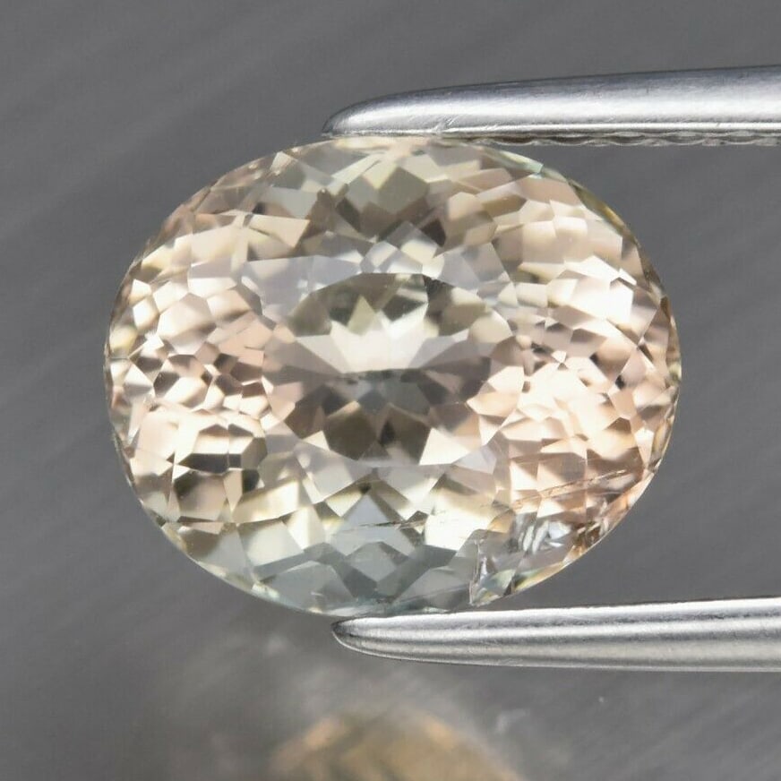 2.34 ct. Natural Unheated Pinkish Yellow Tourmaline - MOZAMBIQUE, AFRICA: 2.34 ct. Natural Unheated Pinkish Yellow Tourmaline - MOZAMBIQUE, AFRICA Shape - Oval Color - Pinkish Yellow Clarity - SI1 Ct. Weight - 2.34 ct. Dimensions - 8.70 x 7.30 x 5.90 mm <