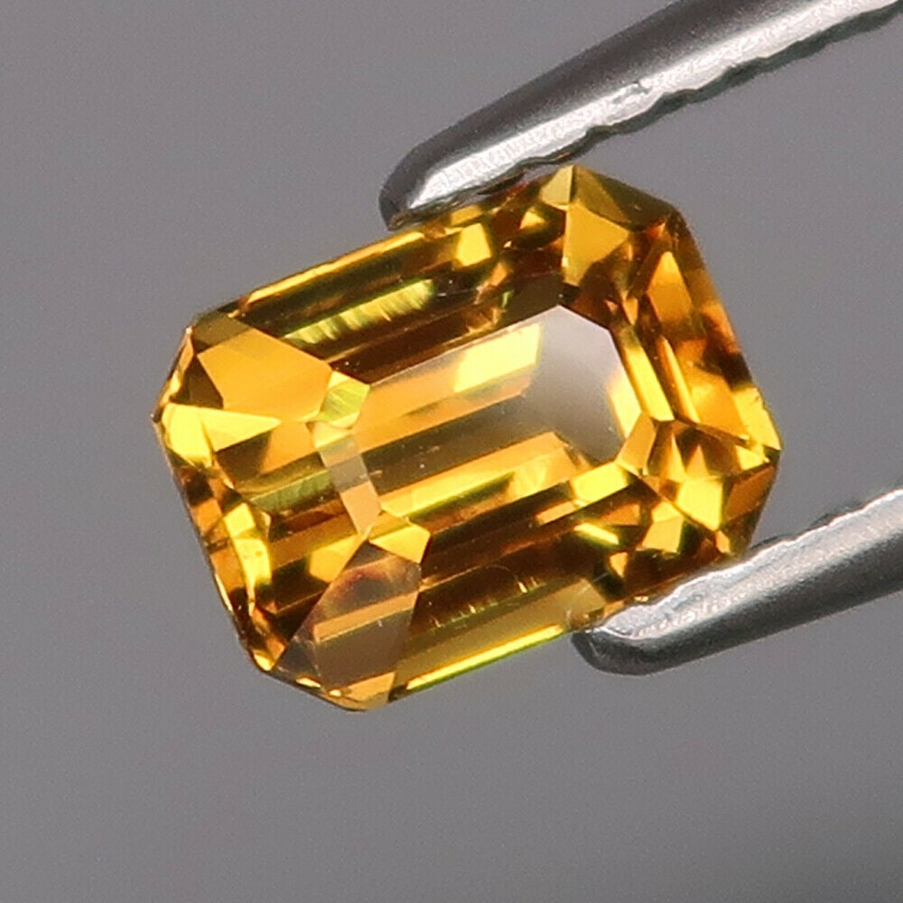 1.20 ct. Natural Yellow Malaya Garnet - AFRICA: 1.20 ct. Natural Yellow Malaya Garnet - AFRICA Color - Yellow Clarity - VS Cut - Emerald cut Ct. Weight - 1.20 ct. Dimensions - 66.40 X 4.70 X 4.20 mm
