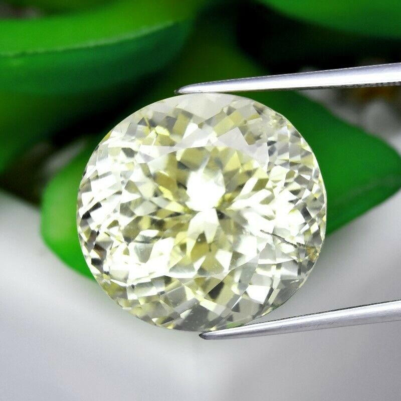 28.00 ct. Natural Triphane Spodumene - AFGHANISTAN: 28.00 ct. Natural Triphane Spodumene - AFGHANISTAN Shape - Oval Color - Yellow Clarity - VS Ct. Weight - 28.00 ct. Dimensions - 18.20 x 17.30 x 13.00 mm Origin - AFGHANIS