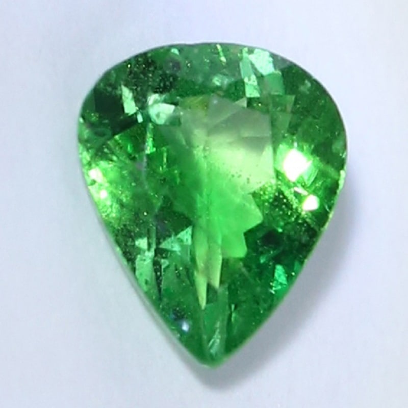 IGI Cert. 0.71 ct. Tsavorite Garnet Untreated - KENYA: IGI Certified 0.71 ct. Tsavorite (Grossularite - Garnet) Untreated - KENYA, EAST-AFRICA Cut - Pear Mixed Cut Color - Green Clarity - SI Ct. Weight - 0.71 ct. Dimensions - 6.34 x 5.25 x 2.8