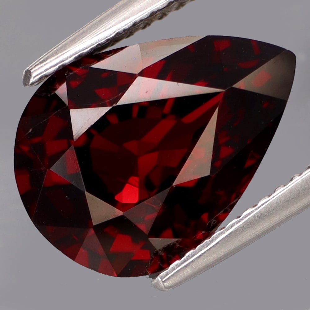 HGL Certified 6.50 ct. Rhodolite Garnet - AFRICA: HGL Certified 6.50 ct. Rhodolite Garnet - AFRICA Ct. Weight - 6.50ct. Shape - Pear Color - Red Clarity - VS Dimensions - 13.50 x 9.80 x 6.50 mm Treatment - None ORI