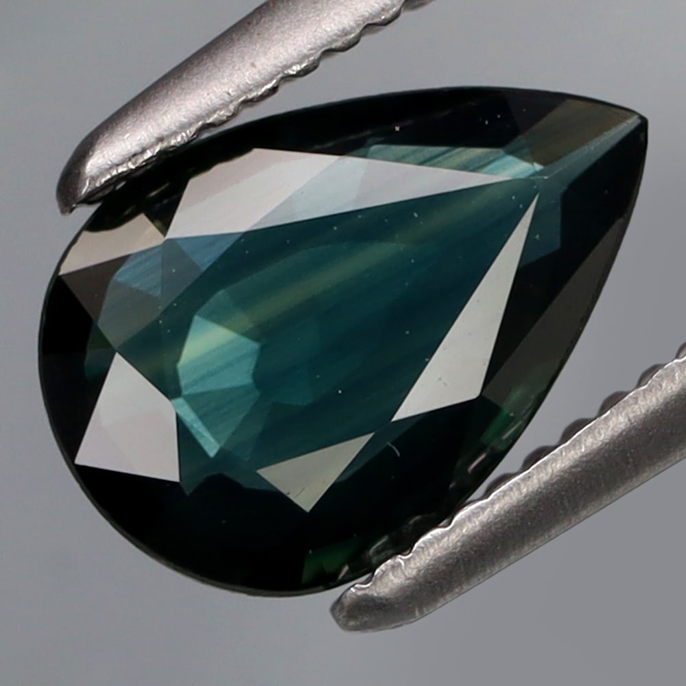 HGL Certified 0.97 ct. Sapphire - AFRICA: HGL Certified 0.97 ct. Sapphire - AFRICA Ct. Weight - 0.97 ct. Shape - Pear Shape Color - Blue Dimensions - 8.5 X 5.9 X 2.1 mm Treatment - Heated ORIGIN - AFRICA