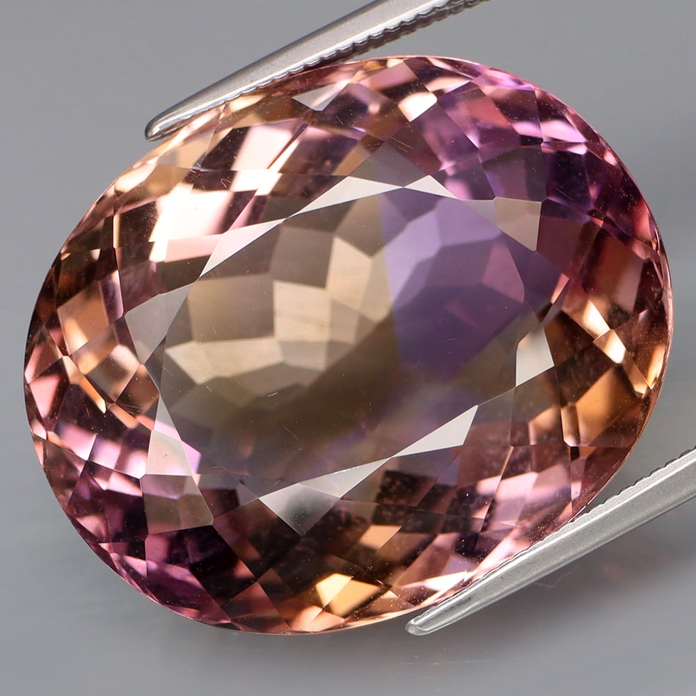 HGL Certified 34.26 ct. Amertine - BOLIVIA: HGL Certified 34.26 ct. Amertine - BOLIVIA Color - Purple & golden Cut - Oval Ct. Weight - 34.26 ct. Size - 22.7 X 18.8 X 12.7mm Treatment - None ORIGIN - BOLIVIA