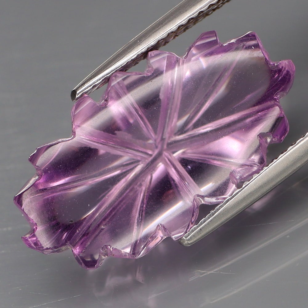 HGL Certified 12.34 ct. Amethyst - BOLIVIA: HGL Certified 12.34 ct. Amethyst - BOLIVIA Color - Purple Cut - Flower carving Ct. Weight - 12.34 ct. Size - 22.4 X 12 X 8.2mm Treatment - None ORIGIN - BOLIVIA<