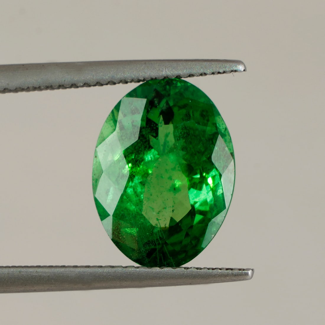 LOTUS Certified 5.48 ct. Tsavorite (Grossular-Garnet) - KENYA, EAST-AFRICA: LOTUS Certified 5.48 ct. Tsavorite (Grossular-Garnet) - KENYA, EAST-AFRICA Cut - Oval Fancy Cut Color - Vivid Green Saturation - Intense Tone - Medium Clarity - VS Ct. Weight - 5.48 ct.</