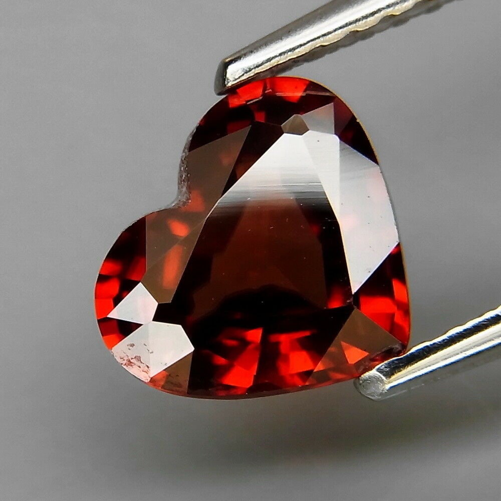 1.78 ct. Red Zircon - TANZANIA: 1.78 ct. Red Zircon - TANZANIA Color - Red Clarity - VS Cut - Heart Ct. Weight - 1.78 ct. Dimensions - 8.00 x 7.00 x 3.50 mm Origin - TANZANIA Treatment - None <