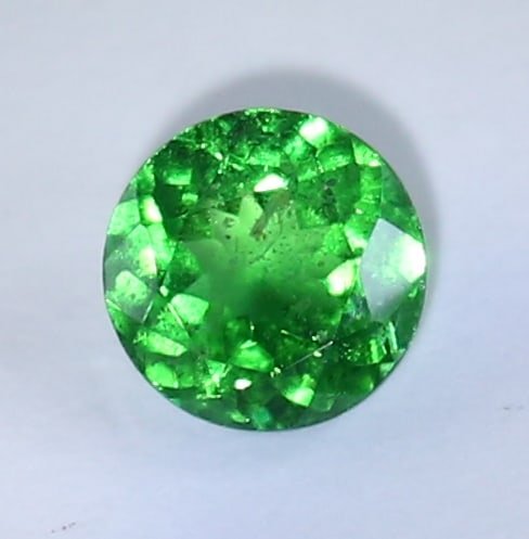 IGI Certified 0.93 ct. Tsavorite Garnet Untreated KENYA: IGI Certified 0.93 ct. Tsavorite (Grossularite - Garnet) Untreated KENYA Cut - Round Mixed Cut Color - Green Clarity - VS Ct. Weight - 0.93 ct. Dimensions - 5.97- 5.88 x 3.36 mm
