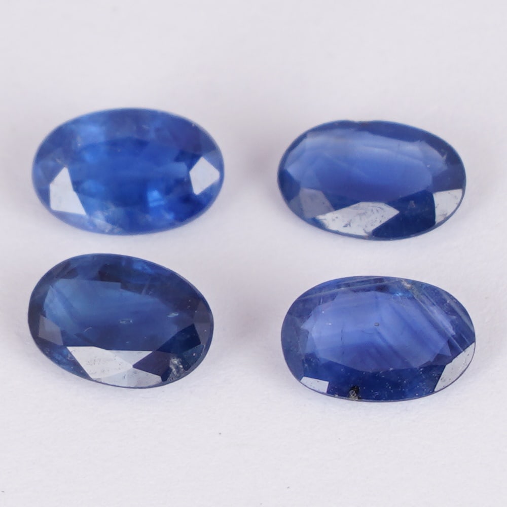 IGI Certified 1.90 ct. Set of 4 Blue Sapphires - MADAGASCAR: IGI Certified 1.90 ct. Set of 4 Blue Sapphires - MADAGASCAR Color - Blue Cut - Oval Mixed cut Clarity - SI Ct. Weight - 0.40 + 0.57 + 0.52 + 0.41 = 1.90 ct. Dimensions - 6.07 x 4.00 x 1.74 mm