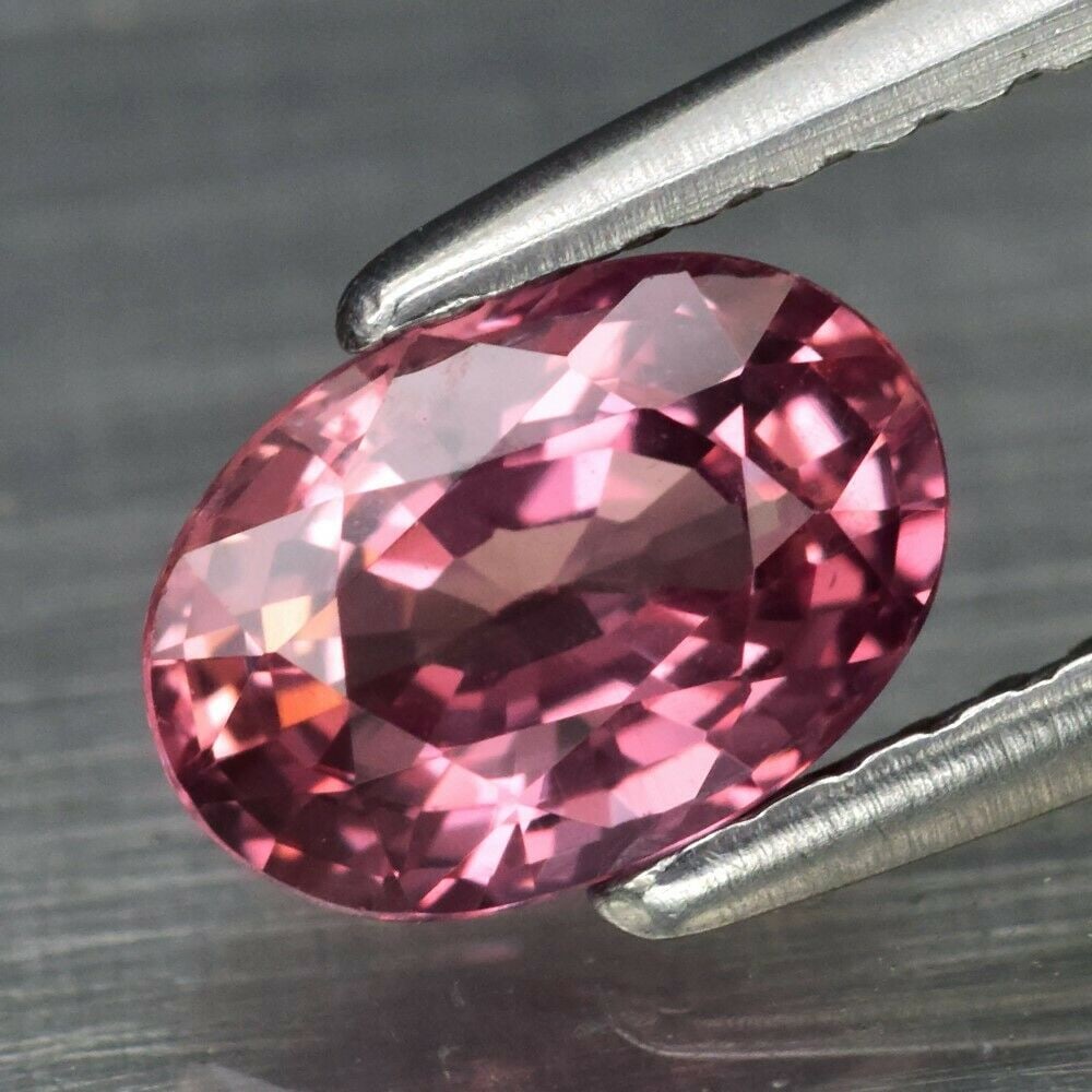 1.04 ct. Natural Padparadscha Sapphire - MADAGASCAR: 1.04 ct. Natural Padparadscha Sapphire - MADAGASCAR Shape - Oval Color - Orangish Pink Clarity - VVS Ct. Weight - 1.04 ct. Dimensions - 7.00 x 4.80 x 3.50 mm Origin - MAD