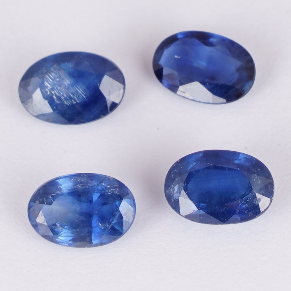 IGI Certified 2.44 ct. Set of 4 Blue Sapphires - MADAGASCAR: IGI Certified 2.44 ct. Set of 4 Blue Sapphires - MADAGASCAR Color - Blue Cut - Oval Mixed cut Clarity - SI Ct. Weight - 0.43 + 0.83 + 0.61 + 0.57 = 2.44 ct. Dimensions - 6.16 x 4.08 x 1.79 mm