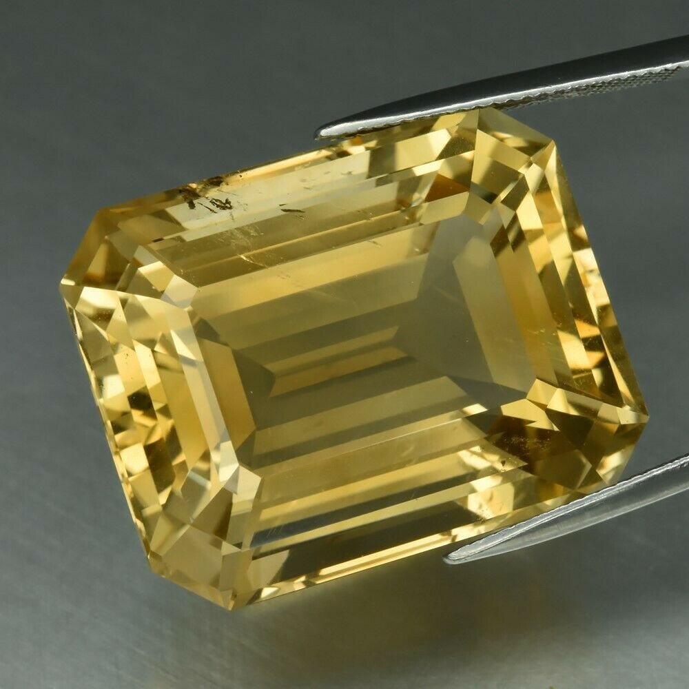 63.78 ct. Natural Yellow Citrine - BRAZIL: 63.78 ct. Natural Yellow Citrine - BRAZIL Color - Yellow Cut - Octagon Ct. Wt. - 63.78 ct. Clarity - VS Dimensions - 26.50 x 21.20 x 15.70 mm Origin - BR