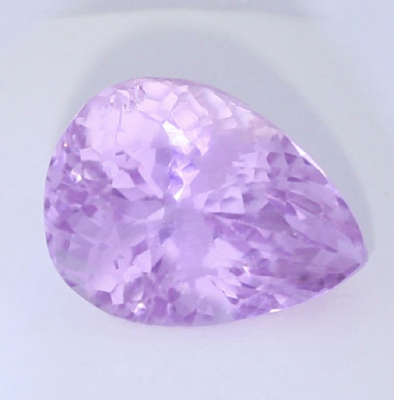 IGI Certified 18.85 ct. Kunzite Purple Pink AFGHANISTAN: IGI Certified 18.85 ct. Kunzite - Purple Pink AFGHANISTAN Excellent Color and clarity Cut - Pear Mixed cut Color - Purple Pink Clarity - VS Ct. Weight - 18.85 ct. Dimensions - 18
