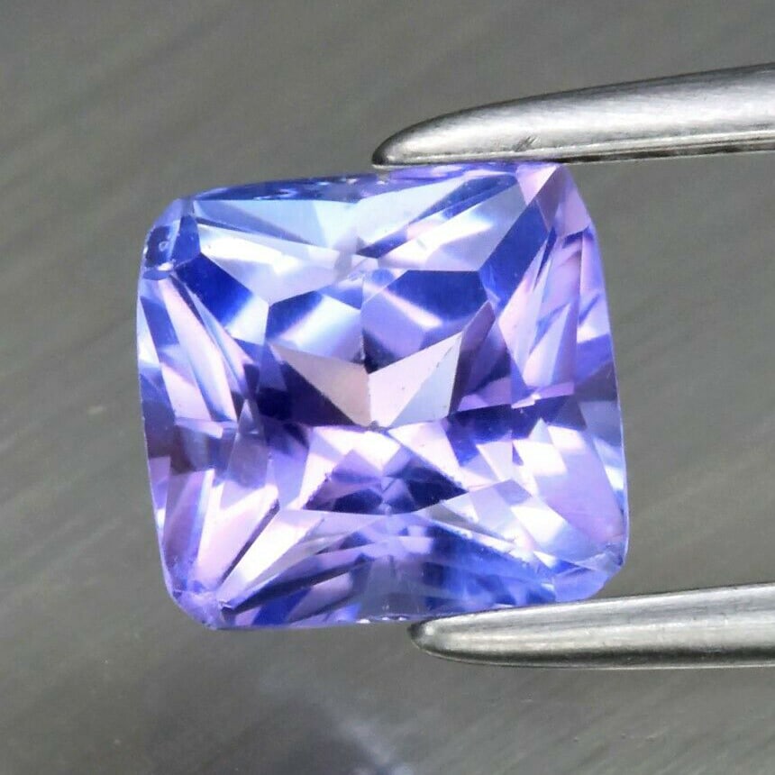 0.86 ct. Natural Violet Blue Tanzanite - TANZANIA: 0.86 ct. Natural Violet Blue Tanzanite - TANZANIA Cut - Radiant cut Color - Violet-Blue Ct. Weight - 0.86 ct. Clarity - VVS Dimensions - 5.60 x 5.20 x 3.70 mm Origin - TA