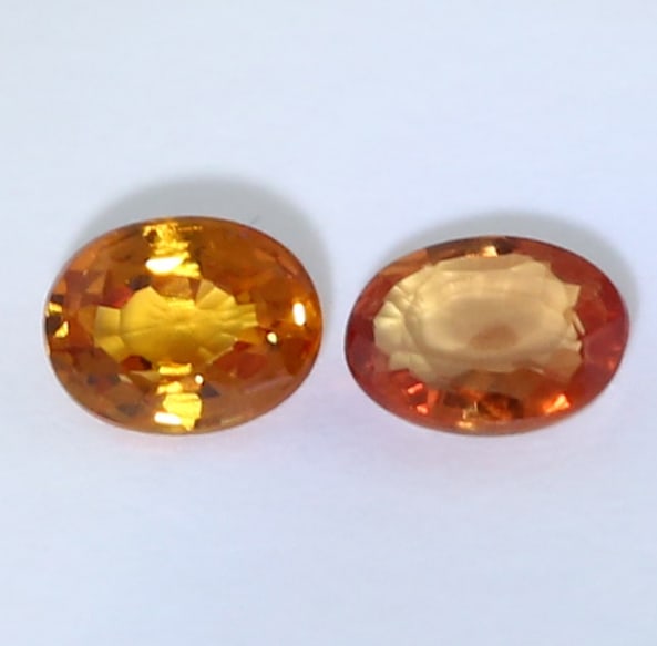 IGI certified Set of 2 Padparadscha Sapphires - MADAGASCAR: IGI certified Set of 2 Padparadscha Sapphires - MADAGASCAR Color - Pinkish Orange Clarity - SI Cut - Oval Mixed Cut Weight - 0.20 + 0.23 = 0.43 ct. Dimensions - 4.02 x 3.11 x 1.55 mm and 4.00