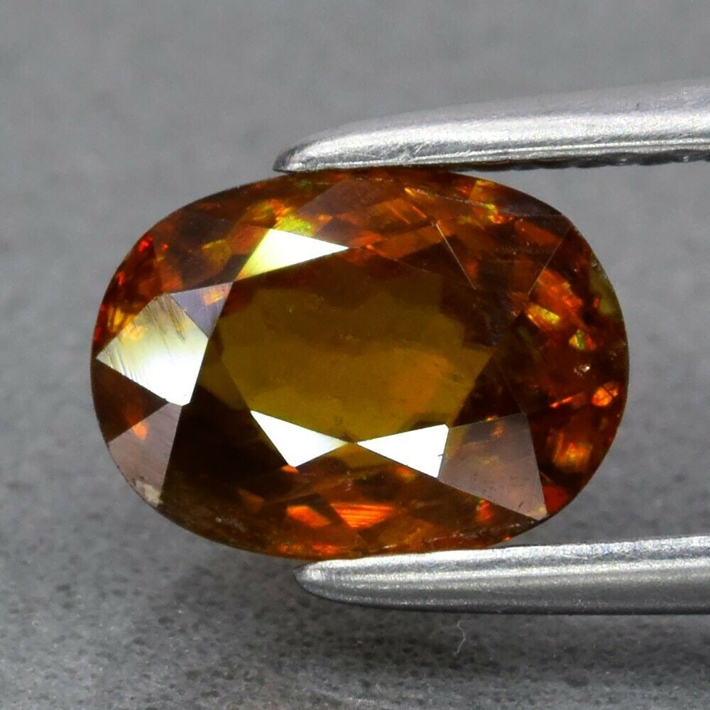 IGI Certified 1.22 ct. Natural Yellowish Brown Sphene - MADAGASCAR, AFRICA: IGI Certified 1.22 ct. Natural Yellowish Brown Sphene - MADAGASCAR, AFRICA Color - Yellowish Brown Cut - Oval Mixed cut Clarity - VS Ct. wt. - 1.22 ct. Dimensions - 7.20 x 5.28 x 3.70 mm