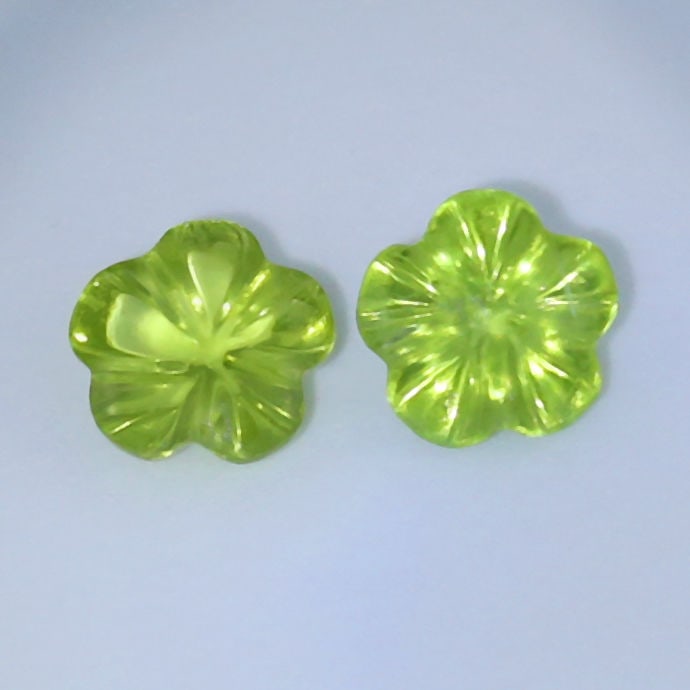 IGI Certified - Set of 2 Flower Cut Peridots PAKISTAN: IGI Certified 2.20 ct. Set of 2 Flower Cut Peridots - PAKISTAN Color - Yellowish GreenCut - Flower cutClarity - VS-SICt. wt. - 0.99 + 1.21 = 2.20 ct.Dimensions - 6.46 x 6.76 x 3.39 mm and 6.47