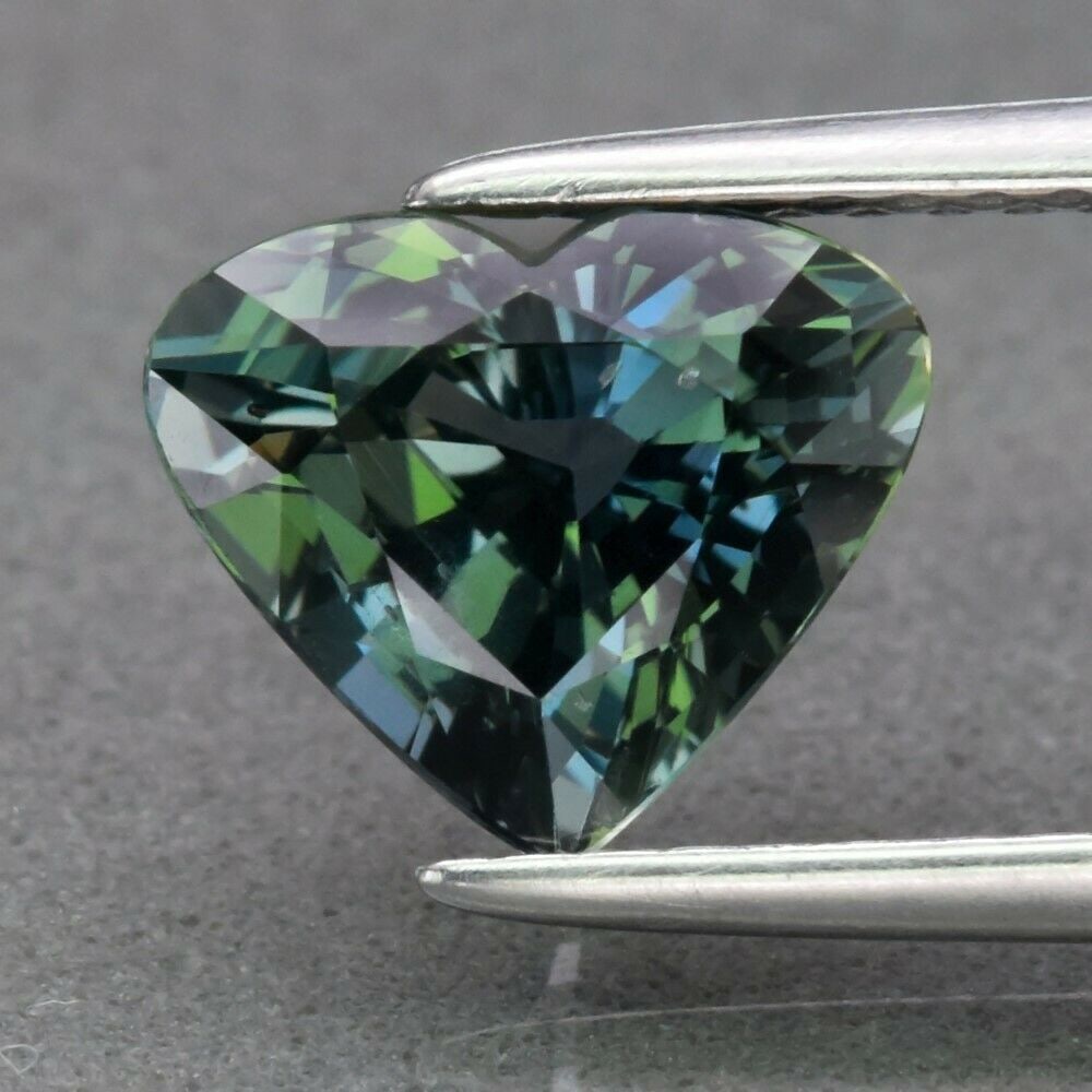 IGI Certified 2.07 ct. Bluish Green Sapphire - TANZANIA: IGI Certified 2.07 ct. Bluish Green Sapphire - TANZANIA Color - Bluish Green Cut - Heart Mixed Cut Ct. Wt. - 2.07 ct. Clarity - VS Dimensions - 7.14 x 8.51 x 4.84 mm Orig