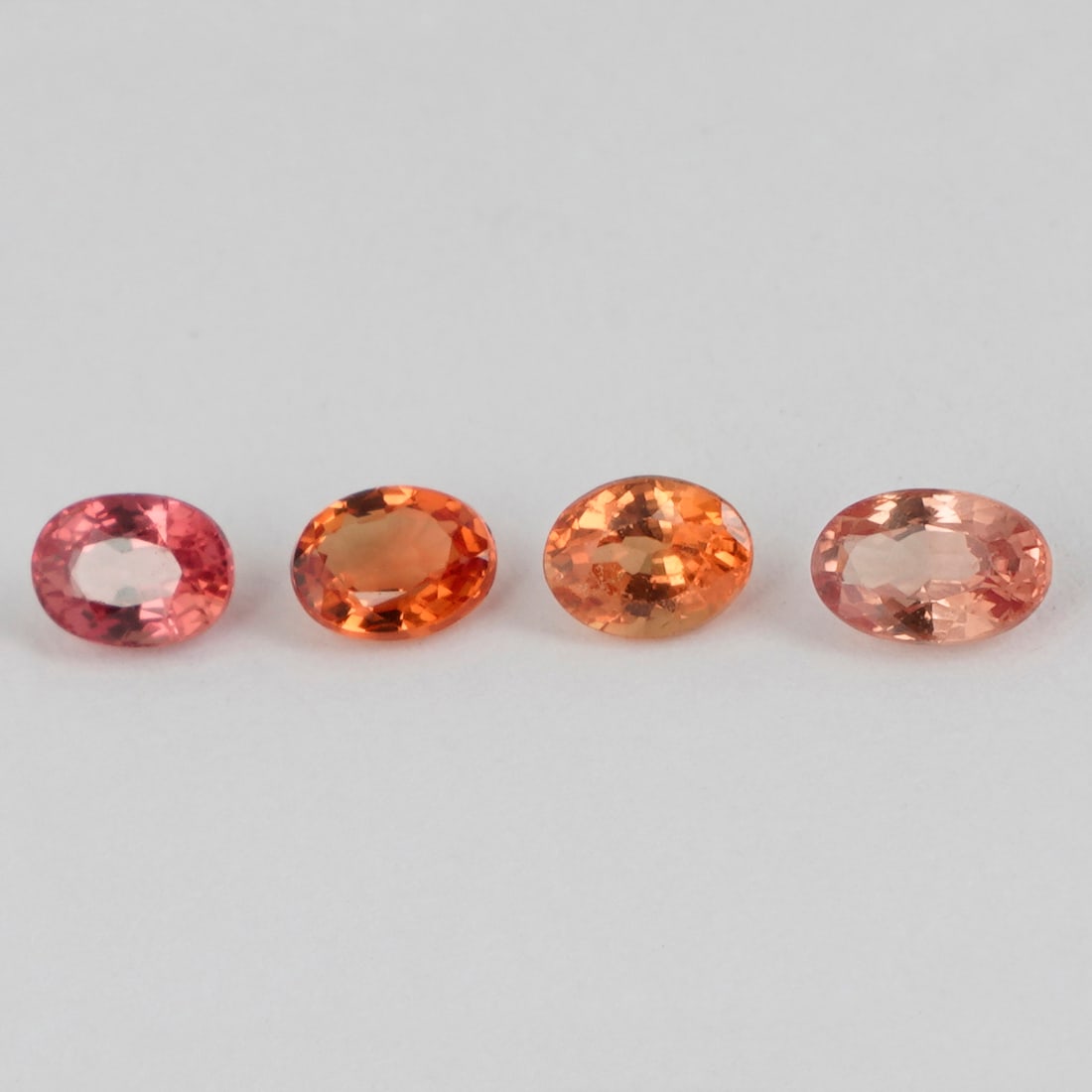 1.11 ct. Set of 4 Orange Sapphires - SRI LANKA, CEYLON: 1.11 ct. Set of 4 Orange Sapphires - SRI LANKA, CEYLON Color - Orange Cut - Oval Brilliant Cut Ct. Wt. - 1.11ct. Clarity - VS No. of Sapphires - 4 Origin - SRI LANKA, CEY