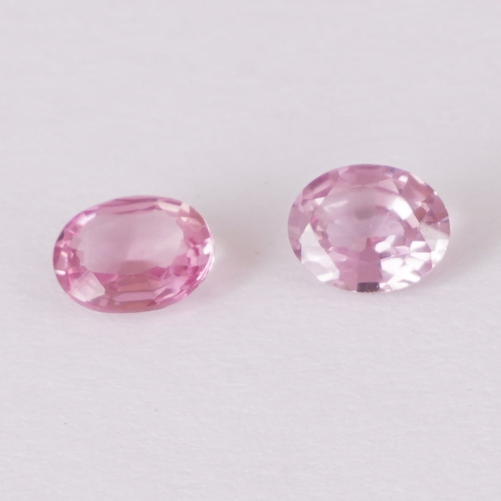 IGI Certified 0.79 ct. Pair (2) Padparadscha Sapphires - MADAGASCAR: IGI Certified 0.79 ct. Pair (2) Padparadscha Sapphires - MADAGASCAR Color - Light Orangy Pink & Pinkish Orange Cut - Oval Mixed cut Clarity - VS Ct. Weight - 0.42 + 0.37 = 0.79 ct. Dimensions