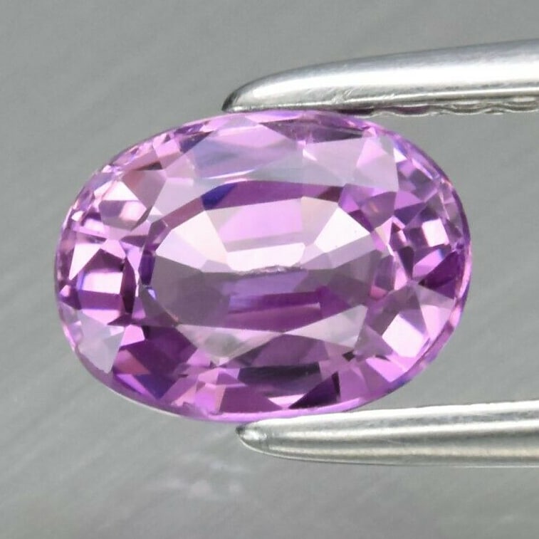 1.04 ct. Natural Pinkish Purple Sapphire - SRI LANKA, CEYLON: 2.22 ct. Natural Unheated Purple Sapphire - AFRICA Shape - Oval Color - Purple Clarity - SI Ct. Weight - 2.22 ct. Dimensions - 8.65 x 7.08 x 3.99 mm Origin - AFRICA
