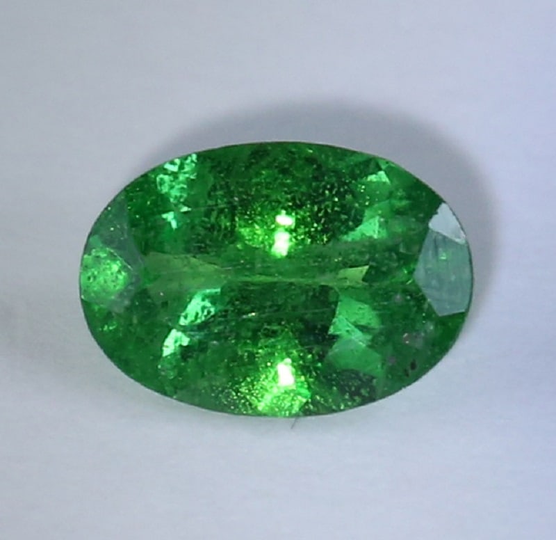IGI Cert. 0.81 ct. Tsavorite Garnet Untreated - KENYA: IGI Certified 0.81 ct. Tsavorite (Grossularite - Garnet) Untreated KENYA, EAST-AFRICA Cut - Oval Mixed Cut Color - Green Clarity - SI Ct. Weight - 0.81 ct. Dimensions - 7.13 x 4.98 x 3.0