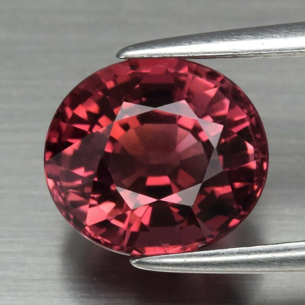 2.29 ct. Natural Unheated Orangy Pink Tourmaline - MOZAMBIQUE: 2.29 ct. Natural Unheated Orangy Pink Tourmaline - MOZAMBIQUE Shape - Oval Color - Orangy Pink Clarity - VS Ct. Weight - 2.29 ct. Dimensions - 8.30 x 7.30 x 5.70 mm Origi