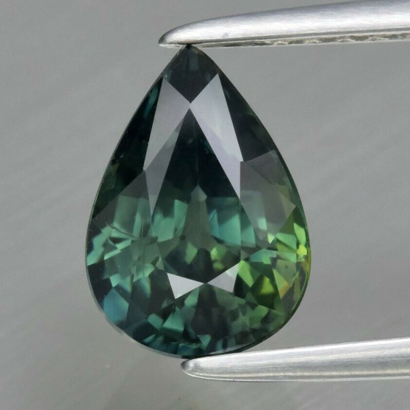 1.68 ct. Natural Bluish Green Sapphire - AUSTRALIA: 1.68 ct. Natural Bluish Green Sapphire - AUSTRALIA Color - Bluish Green Cut - Pear Ct. Wt. - 1.68 ct. Clarity - VVS Dimensions - 8.40 x 6.00 x 4.40 mm Origin - AUSTRALIA<