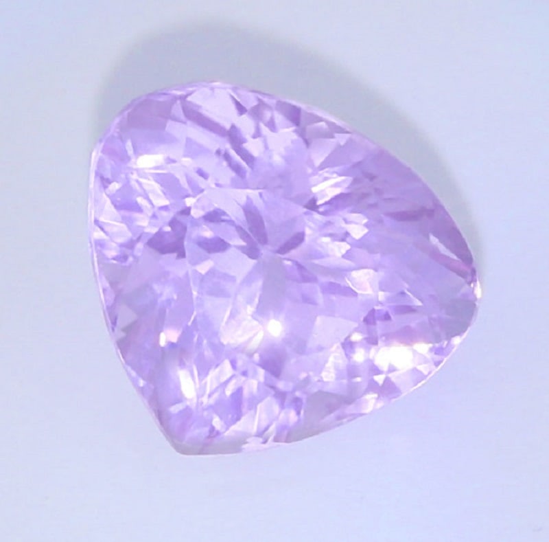 IGI Certified 9.18 ct. Kunzite Purple Pink AFGHANISTAN: IGI Certified 9.18 ct. Kunzite - Purple Pink - AFGHANISTAN Excellent Color and clarity Cut - Pear Mixed cut Color - Purple Pink Clarity - VVS Ct. Weight - 9.18 ct. Dimensions - 1