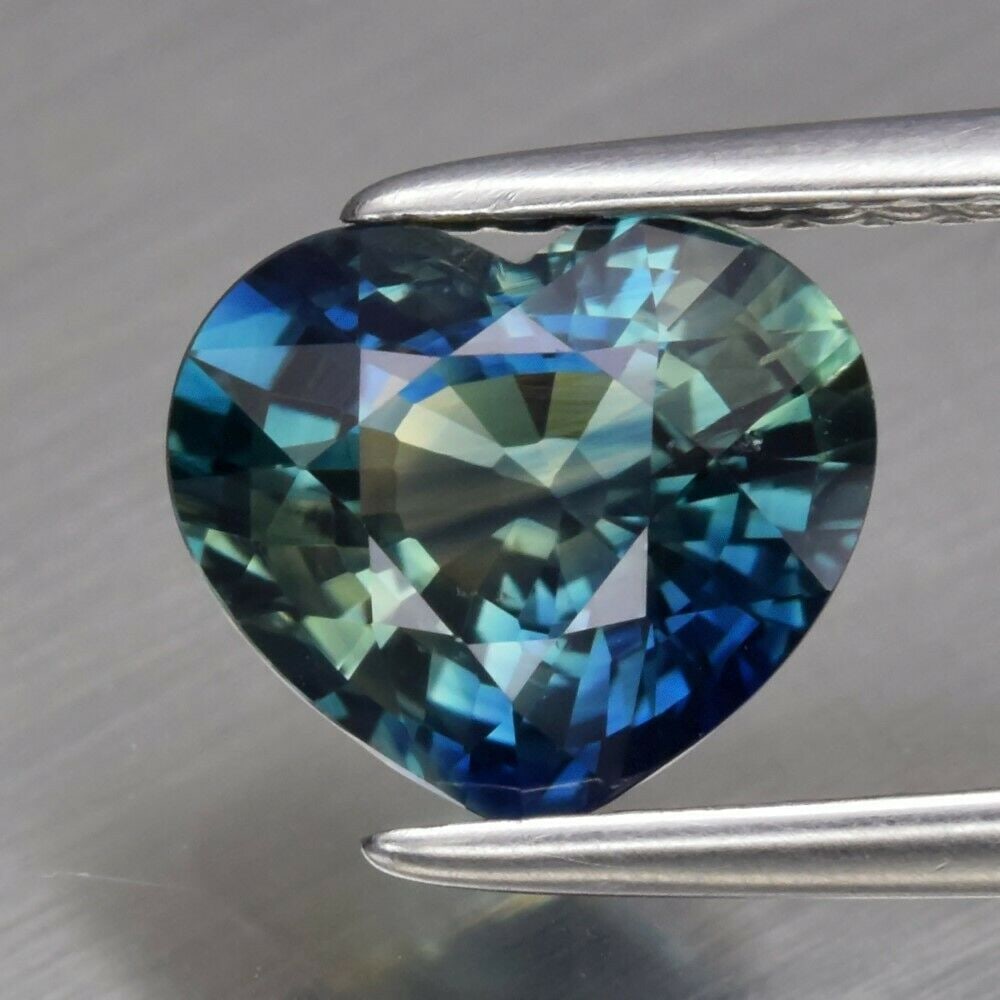 1.80 ct. Natural Unheated Greenish Blue Sapphire - AUSTRALIA: 1.80 ct. Natural Unheated Greenish Blue Sapphire - AUSTRALIA Color - Greenish Blue Cut - Heart Clarity - VS Ct. wt. - 1.80 ct. Dimensions - 7.82 x 6.78 x 4.28 mm Origin -