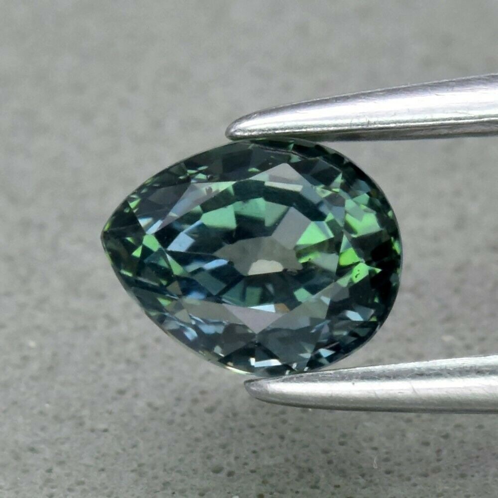 1.02 ct. Natural Unheated Greenish Blue Sapphire - TANZANIA: 1.02 ct. Natural Unheated Greenish Blue Sapphire - TANZANIA Shape - Pear Color - Greenish Blue Clarity - VS Ct. Weight - 1.02 ct. Dimensions - 5.70 x 4.60 x 4.30 mm Origin -