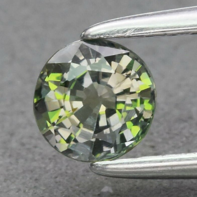 0.54 ct. Natural Unheated Yellowish Green Sapphire - TANZANIA: 0.54 ct. Natural Unheated Yellowish Green Sapphire - TANZANIA Shape - Round Color - Yellowish Green Clarity - VVS Ct. Weight - 0.54 ct. Dimensions - 4.52 x 4.48 x 3.02 mm Origin