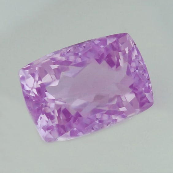 IGI Certified 20.96 ct. Kunzite Purple Pink AFGHANISTAN: IGI certified 20.96 ct. Kunzite - Purple Pink - AFGHANISTAN 100% Natural Cut - Rectangular Cushion Mixed Cut Color - Purple Pink Clarity - VVS Ct. Weight - 20.96 ct. Dimension