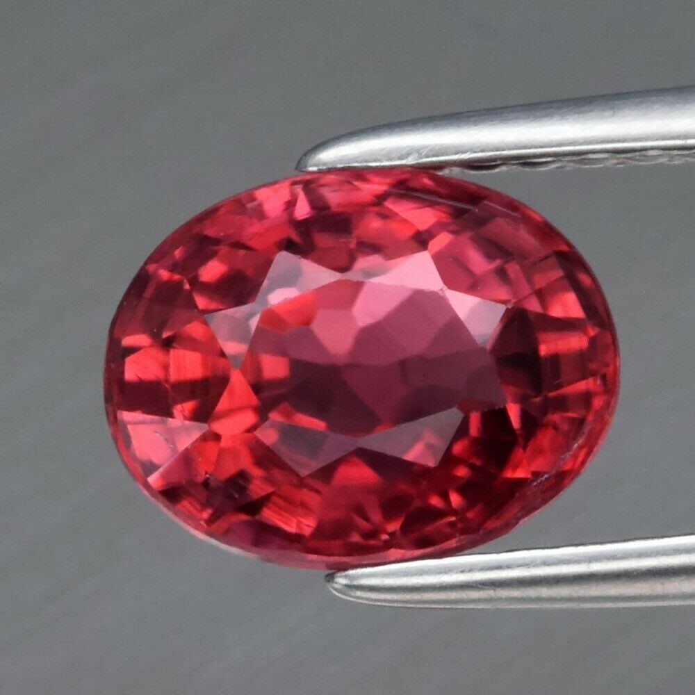 1.71 ct. Natural Unheated Pinkish Orange Tourmaline - MOZAMBIQUE, AFRICA: 1.71 ct. Natural Unheated Pinkish Orange Tourmaline - MOZAMBIQUE, AFRICA Color - Pinkish Orange Cut - Oval Clarity - SI1 Ct. wt. - 1.71 ct. Dimensions - 8.00 x 6.00 x 5.00 mm Ori