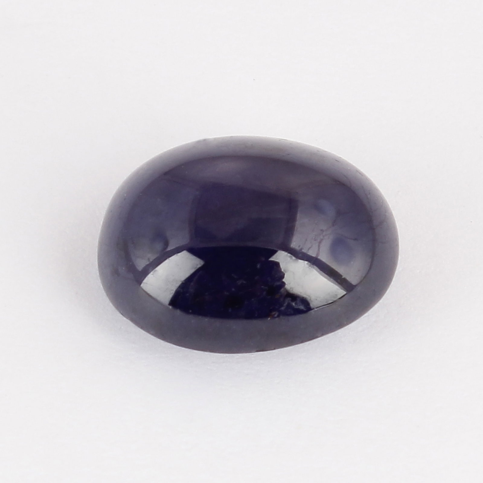 GFCO (SWISS) Certified 10.29 ct. Blue Sapphire - AFRICA: GFCO (SWISS) Certified 10.29 ct. Blue Sapphire - AFRICA Cut - Oval Cabochon Color - Blue Clarity - Semi-Transparent Ct. Weight - 10.29 ct. Dimensions - 12.90 x 11.02 x 7.09 mm O