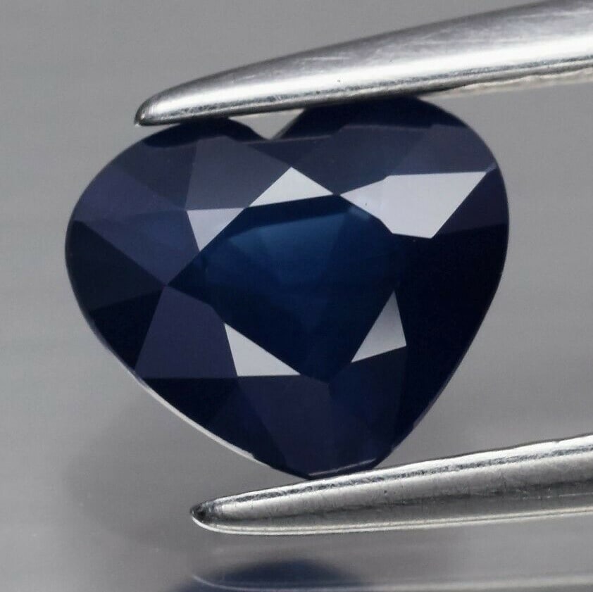 0.98 ct. Natural Deep Blue Sapphire - MADAGASCAR: 0.98 ct. Natural Deep Blue Sapphire - MADAGASCAR Shape - Heart Color - Deep Blue Clarity - SI1 Ct. Weight - 0.98 ct. Dimensions - 6.50 x 5.50 x 3.40 mm Origin - MADAGASCA