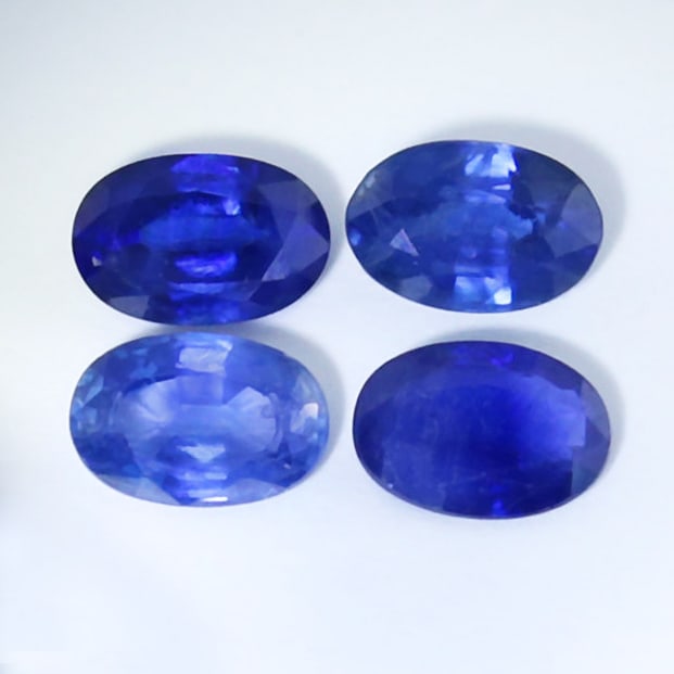 Set of 4 IGI Certified 2.39 ct. Blue Sapphires: Set of 4 IGI Certified 2.39 ct. Blue Sapphires Color - Blue and Deep Blue Cut - Oval Mixed cut Clarity - VS-SI Ct. wt. - 0.76 + 0.45 + 0.64 + 0.54 = 2.39 ct. Dimensions - 6.00 x 4.02 x 3.30 mm