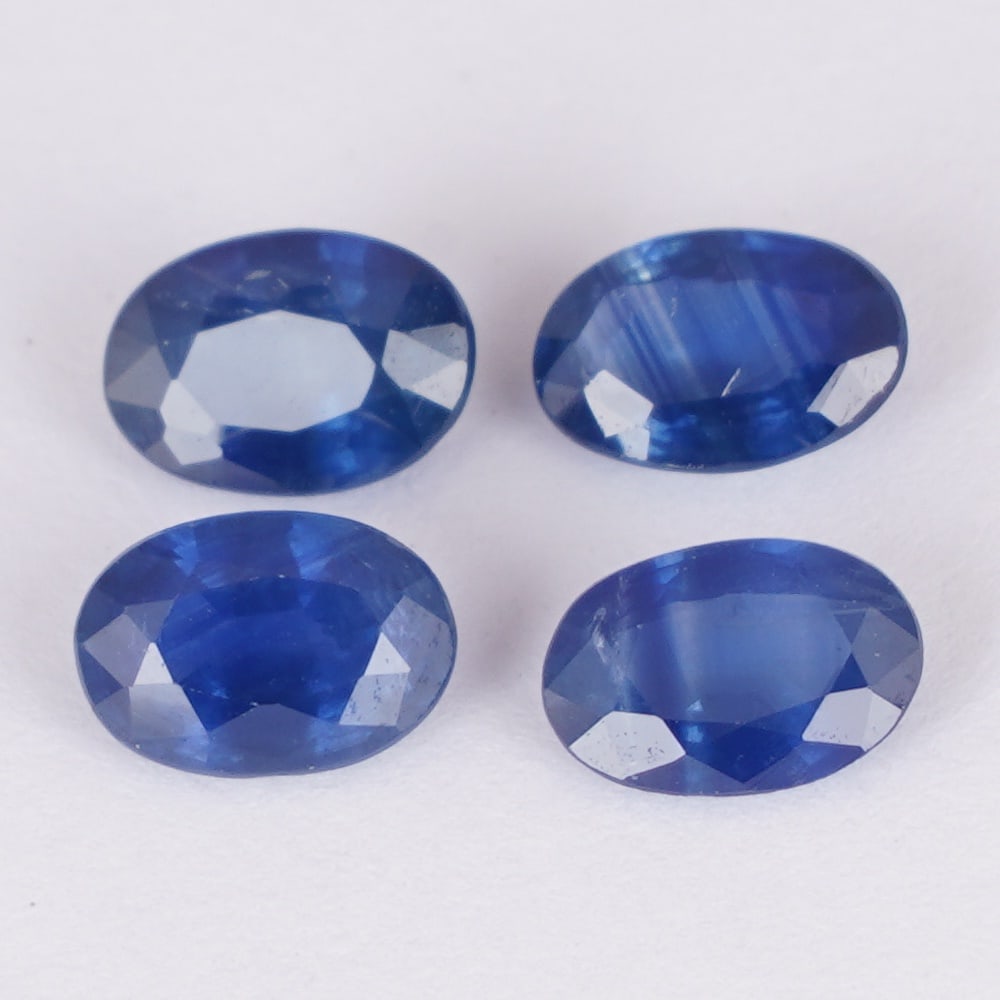 IGI Certified 1.98 ct. Set of 4 Blue Sapphires - MADAGASCAR: IGI Certified 1.98 ct. Set of 4 Blue Sapphires - MADAGASCAR Color - Blue Cut - Oval Mixed cut Clarity - SI Ct. Weight - 0.54 + 0.41 + 0.48 + 0.55 = 1.98 ct. Dimensions - 5.77 x 4.02 x 2.65 mm