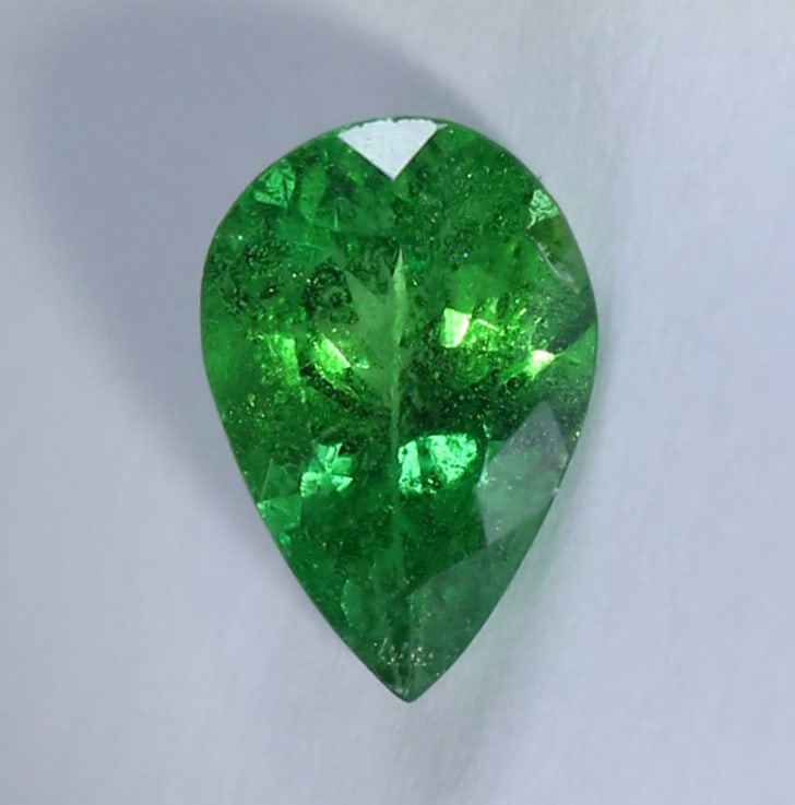 IGI Certified 0.87 ct. Tsavorite Garnet Untreated KENYA: IGI Certified 0.87 ct. Tsavorite (Grossularite - Garnet) Untreated - KENYA, EAST-AFRICA Cut - Pear Mixed Cut Color - Green Clarity - SI Ct. Weight - 0.87 ct. Dimensions - 7.67x 5.19 x 3.38