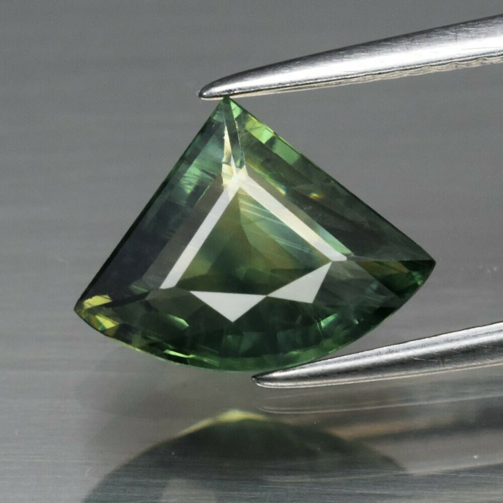 2.18 ct. Natural Yellowish Green Sapphire - MADAGASCAR: 2.18 ct. Natural Yellowish Green Sapphire - MADAGASCAR Shape - Fancy Fan Color - Yellowish Green Clarity - SI1 Ct. Weight - 2.18 ct. Dimensions - 10.80 x 8.20 x 3.60 mm Origin