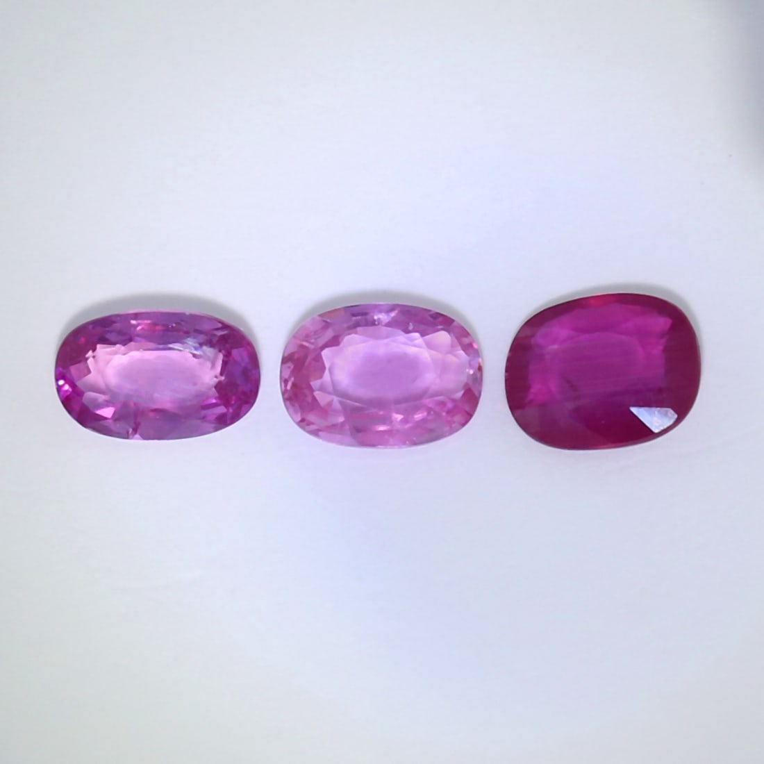IGI Certified - Set of 3 Rubies 1.97 ct. - BURMA: IGI Certified 1.97 ct. Set of 3 Rubies - BURMA Cut - Oval Mixed Cut and Rectangular Cushion Mixed Cut Color - Purplish Red Clarity - SI - I Ct. Weight - 0.66 + 0.65 + 0.66 = 1.97 ct. Dimension